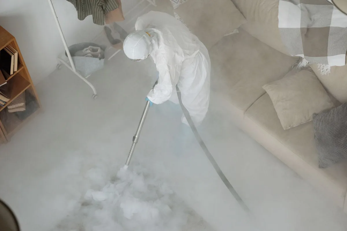 Biohazard cleanup technician in protective equipment, Dolgeville, NY